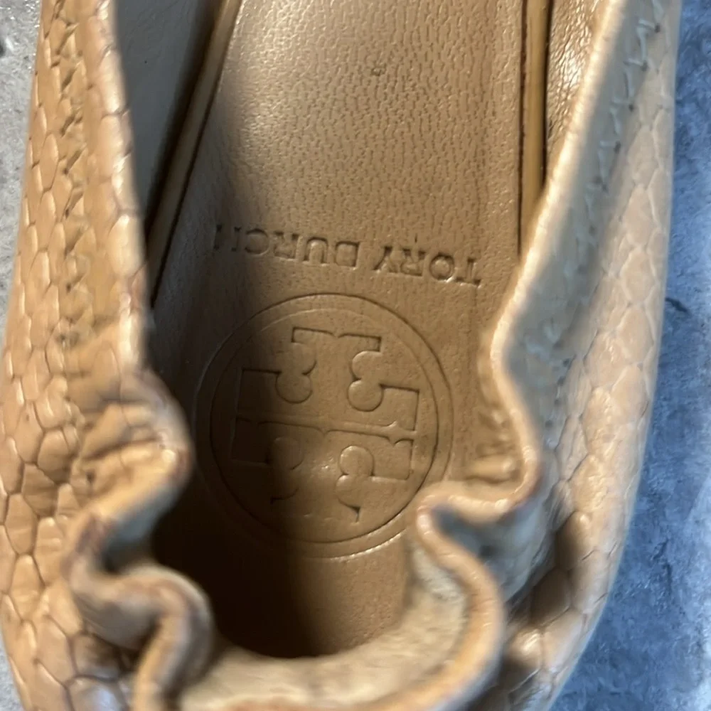 Tan Tory Burch flats with gold emblem
